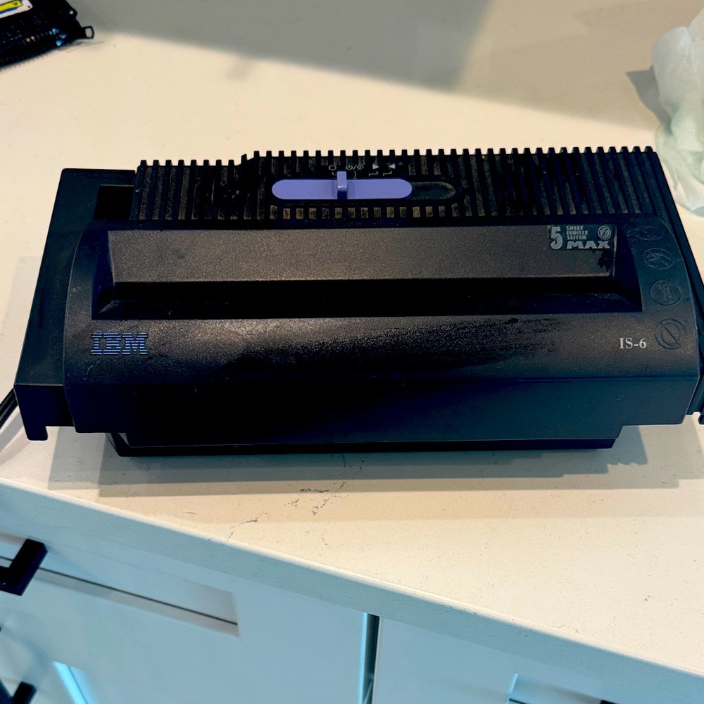 IBM Paper Shredder- adjustable to fit over garbage can. Works great.